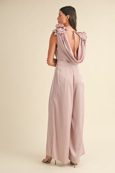 Isabela – Jumpsuit mit Blumenapplikationen & tiefem Wasserfallausschnitt